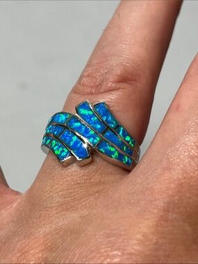 Blue Opal-Inlay Wave Ring. 
Stamped 925. Sterling Silver
Size 7.